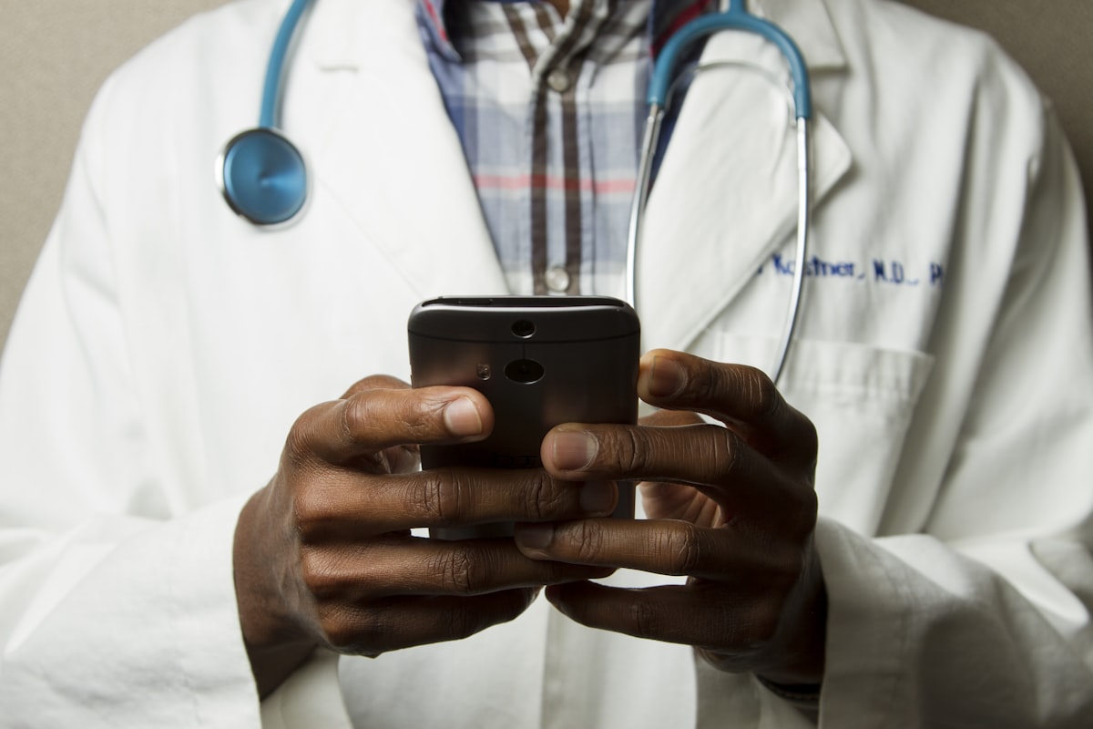 Doctor using a phone for a remote consultation